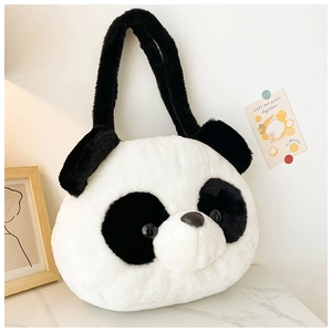 Close-up of soft faux fur texture on a plush panda handbag with black and white details