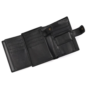 Close-up of black genuine leather wallet interior with card slots and snap coin pocket