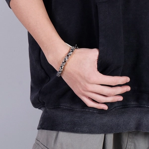 Men's silver emperor chain bracelet in titanium steel shown on male model wrist