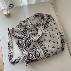 Detail of bohemian paisley pattern on spacious cotton linen shoulder bag