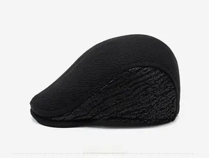Side view of men's black wool beret cap featuring grey wave pattern fabric detail