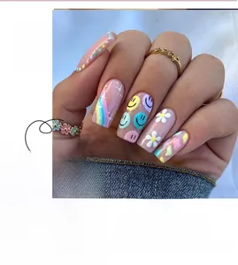 Detailed long coffin press-on nails with colorful flowers, smiley face and rainbow designs