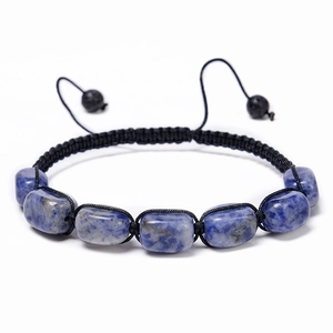 Macro shot of blue square natural stone beads on a black hand-woven adjustable bracelet