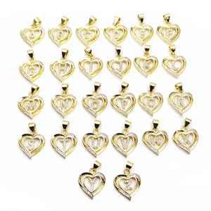 Detailed array of golden heart-shaped pendants with inlaid zircon letters from A to Z