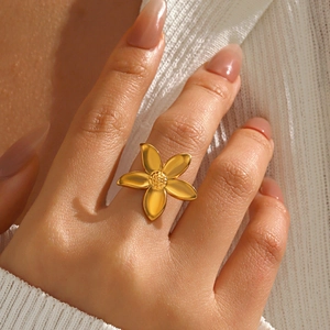 Exquisite gold stainless steel flower ring for women worn on finger in a chic style