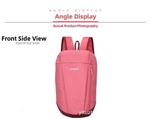 Detailed view of pink sports backpack with wide shoulder straps and durable nylon fabric