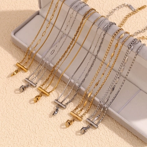 Detailed close-up showing various chain styles in gold and silver stainless steel