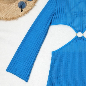 Detailed view of blue crochet bikini with hollow design and stylish metal ring accent