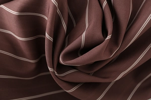 Detail shot of the vertical white stripes on dark coffee fabric with premium texture