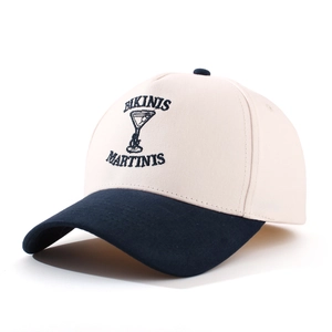 Detail of embroidered Bikinis & Martinis lettering on a retro two-tone baseball cap