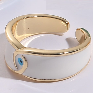 Detailed macro view of the 14K gold evil eye enamel ring with blue and white accents