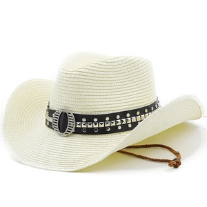 Detail of straw cowboy hat with a studded leather band and adjustable chin strap
