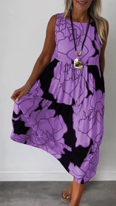 Sleeveless maxi dress in purple and black floral print featuring a loose fit silhouette