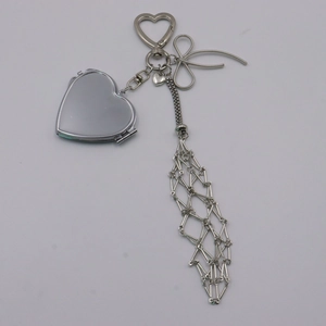 Silver heart mirror keychain with elegant metal mesh tassel and bow decoration