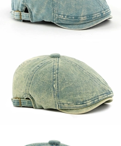 Detail van de gewassen denim krantenjongenspet met metalen gesp en stoftextuur