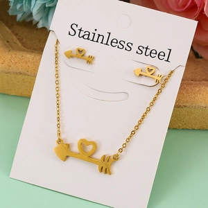 Golden stainless steel jewelry set featuring cupid arrow with hollow heart on white card