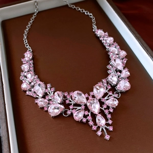 Detailed shot of pink crystal teardrop pendant necklace in a luxury jewelry box