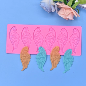 Pink 6-cavity angel wing silicone mold for DIY chocolate and fondant crafting