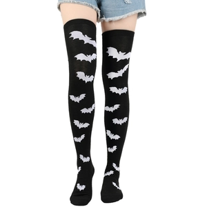 Close-up detail of black over-the-knee socks with white bat patterns for Halloween