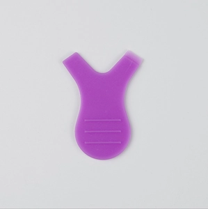 Macro view of purple Y-shaped lash brush for eyelash grafting and perming extensions