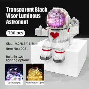 Detail of 780pcs astronaut building block pen holder with glowing LED and red heart icon