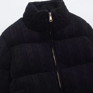 Women's black knit quilted jacket with stand collar and cable texture zipper closure