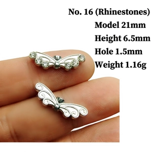 Detailed view of silver angel wing charms with rhinestones for DIY jewelry making
