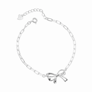 Elegant S925 sterling silver bow chain bracelet with heart charm on a white background