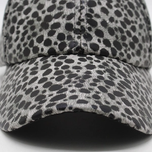 Macro shot of the black and grey leopard print texture on this stylish baseball cap