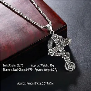 Vintage silver gothic dragon cross necklace with skull pendant on a textured dark background
