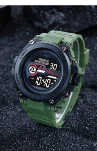 Detail of military green digital sports watch with WR30M water resistance on dark stone