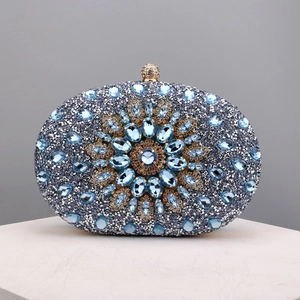 Close-up of blue and silver rhinestones with a central gemstone sunflower design