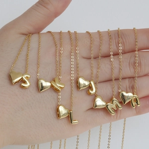 Polished 18k gold heart-shaped alphabet pendant necklace with personalized initials