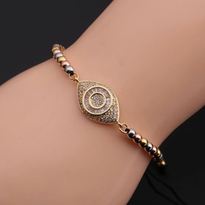 Adjustable evil eye bracelet with gold zircon charm and tricolor metal beads on black cord