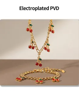 Detailed view of gold cherry bracelet with red glass stones and PVD plating finish