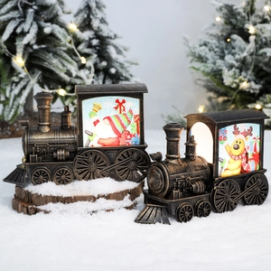 Vintage bronze Christmas train lantern with Santa and elk patterns in festive snowy setting
