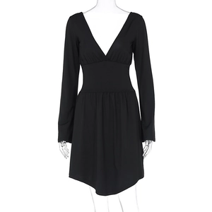 Detail of the deep V-neckline and elastic high waist on this black long sleeve dress