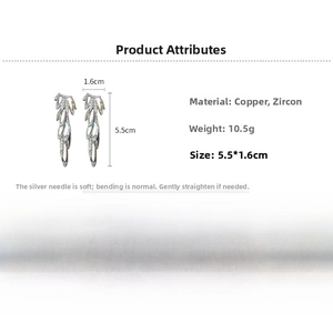 Detail view of silver zircon wing earrings with dimensions 5.5cm x 1.6cm and s925 needles