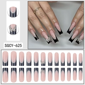 French long pink nails with black tips, silver glitter butterflies and rhinestone accents