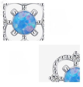 Makro-Detail von S925 Sterlingsilber Opal-Ohrsteckern mit brillanten blauen Feuerfarben