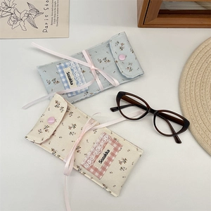 Floral fabric eyewear pouch with lace details and ribbon tie for glasses storage