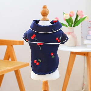 Detail of navy blue pet silk pajamas with red cherry print and classic lapel collar