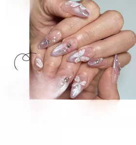 Detailed view of almond-shaped purple gradient press-on nails with 3D butterfly charms