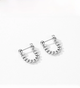 Detail of S925 sterling silver chain earrings with polished sphere stud and cuban link