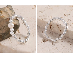Detailed close-up of S925 sterling silver beaded rings with a white pearl on stone