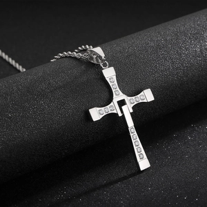 Detailed macro of the Fast and Furious Toretto silver cross pendant with sparkling crystals