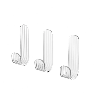 Set of 3 transparent adhesive J-shaped hooks with striped texture on a white background
