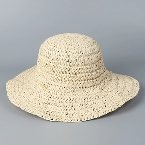 Detailed close-up of handmade crochet straw hat with breathable weave texture