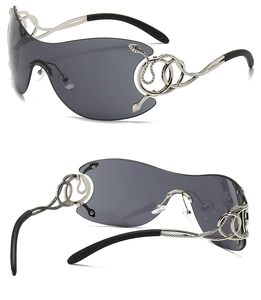 Detail of silver snake-shaped metal hinges on oversized rimless smoke sunglasses
