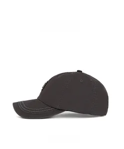 Side view of washed dark grey cotton baseball cap with decorative wavy brim stitching